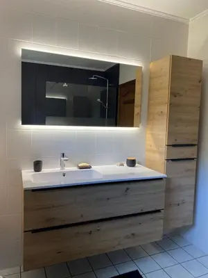 a bathroom with a sink and a mirror at Le Logis du Plateau in Herve