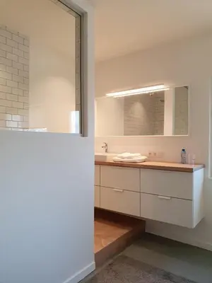 a bathroom with a sink and a mirror at Le Chateau Blanc in Verviers