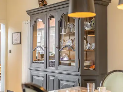 a gray cabinet with dishes in it at Maison Cuberdon in Riemst