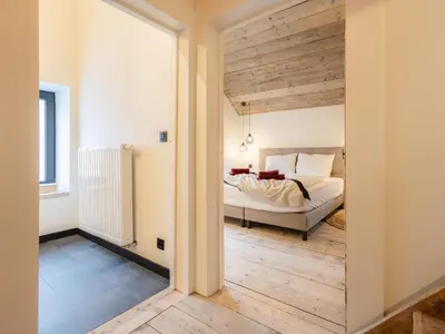 a bedroom with a bed in a room at Maison Cuberdon in Riemst