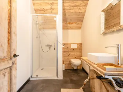 a bathroom with a shower and a sink at Maison Cuberdon in Riemst