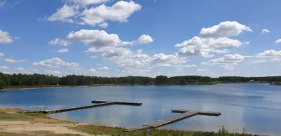 a large lake with a dock in the middle at Brelaarheide in Houthalen-Helchteren