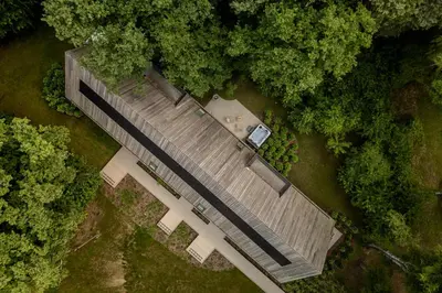 an overhead view of a building in the middle of a forest at Woodz Lodges in Heusden - Zolder