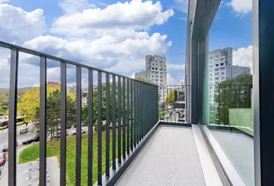 a balcony with a view of a city at L'appart Baobab, avec sauna in Liège