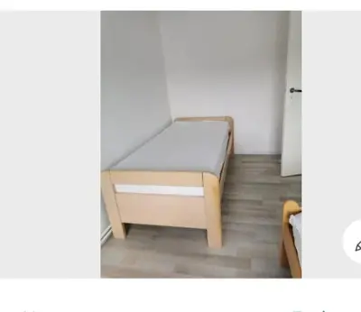 a small bedroom with a bed in a room at Vintage house ViVa in Leopoldsburg