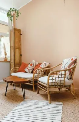 two chairs and a coffee table in a living room at Superbe appartement avec cheminée in Verviers