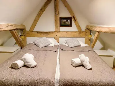 a bedroom with two beds with towels on them at Beautiful appartment in Voeren in Voeren