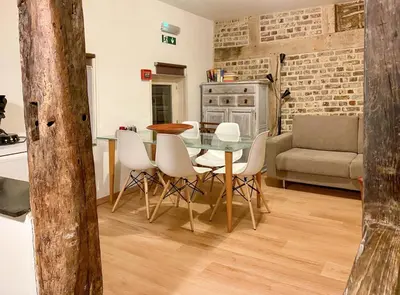 a kitchen and dining room with a table and chairs at Beautiful appartment in Voeren in Voeren