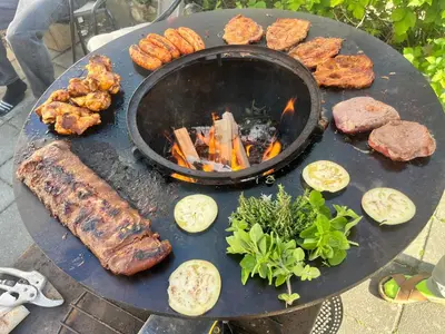 a grill with different types of meat and vegetables at De Koer Kanne - bij Maastricht in Kanne