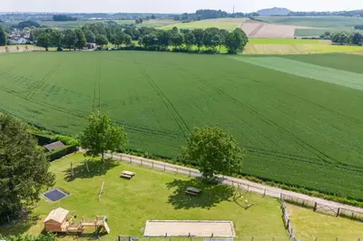 an aerial view of a large field with a picnic table at NIEUW De Grenspaal NOORD 6P - 3SLPK 5 min Maastricht - SAUNA - LAADPAAL in Riemst
