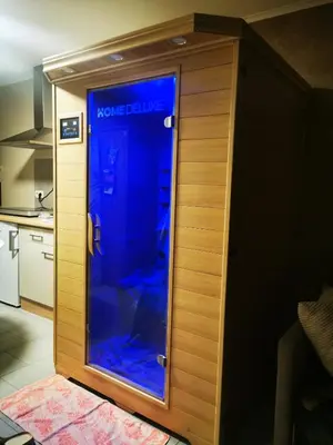 a room with a blue glass door in a kitchen at Studio Les Champs in Baelen
