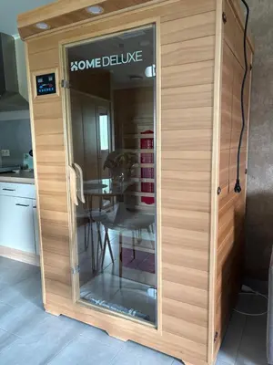 a glass door in a kitchen with a table at Studio Les Champs in Baelen