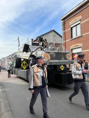 two men walking in front of a military truck at Studio Les Champs in Baelen
