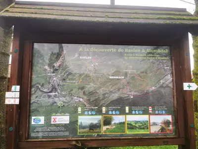 a sign with a map of a park at Studio Les Champs in Baelen