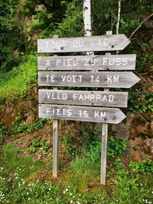 a sign in the middle of a trail at Studio Les Champs in Baelen