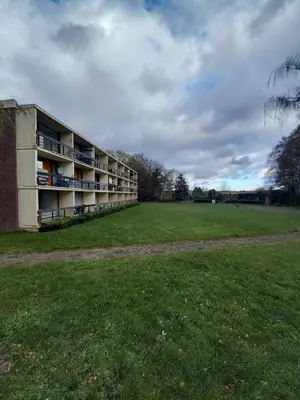 an empty building with a field in front of it at Ap22 Nature Ardennes Economy class apartment in La Calamine
