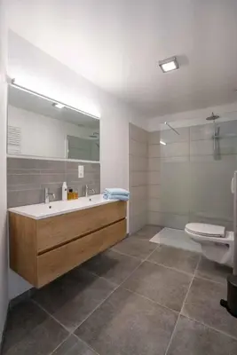a bathroom with a tub and a toilet and a sink at Vakantiewoningen Hoeve Carpe Diem - Dalhem - Aubel - Voeren in Dalhem