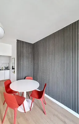 a dining room with a white table and red chairs at Smart Appart - City Center Liege in Liège