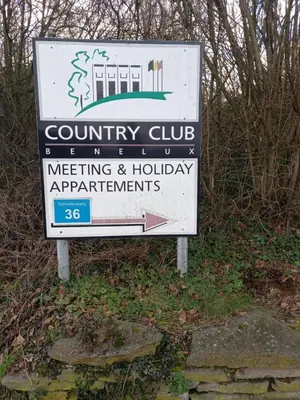 a sign for a county club meeting and holiday applications at Ap5 Nature Ardennes Economy class apartment in La Calamine