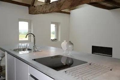 a kitchen with a sink and a counter top at Holiday Home Janssen & Janssen in Maasmechelen