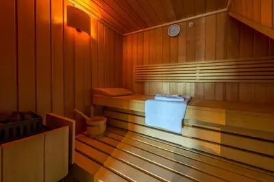 a sauna with a towel in the middle of it at Holiday Home Janssen & Janssen in Maasmechelen
