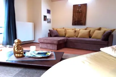 a living room with a couch and a table at Point Escale in Lontzen