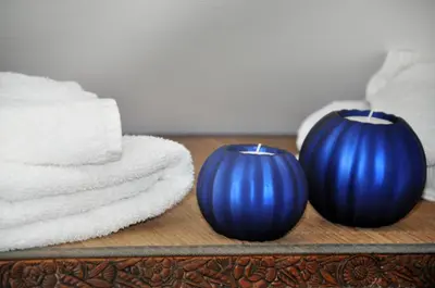 two blue vases sitting on a table with towels at Point Escale in Lontzen
