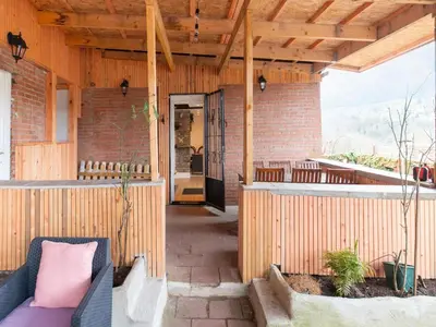 an outdoor patio with a wooden pergola at Charming Family Home in Esneux in Esneux