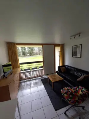 a living room with a couch and a table at Ap4 Nature Ardennes Economy class apartment in La Calamine