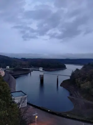 a river with a bridge in the middle of it at Ap4 Nature Ardennes Economy class apartment in La Calamine