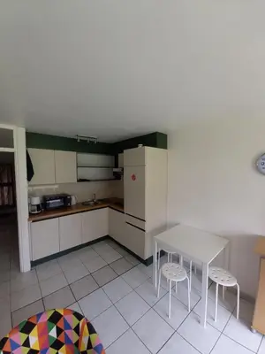 a kitchen with a table and two stools at Ap4 Nature Ardennes Economy class apartment in La Calamine