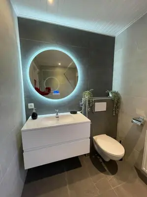 a bathroom with a sink and a toilet and a mirror at Happiness at Lili in Verviers
