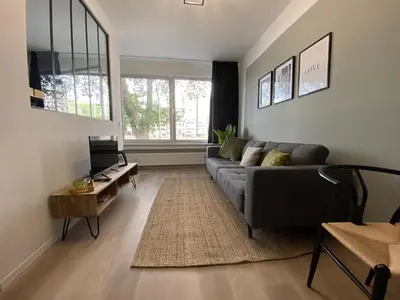 a living room with a couch and a table at 