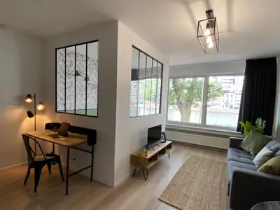 a living room with a table and a couch at 