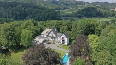 an aerial view of a large house with a pool at Lafarques in Pepinster