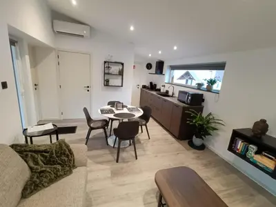 a living room with a couch and a table at Gusta in Maasmechelen