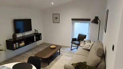 a living room with a couch and a table at Gusta in Maasmechelen