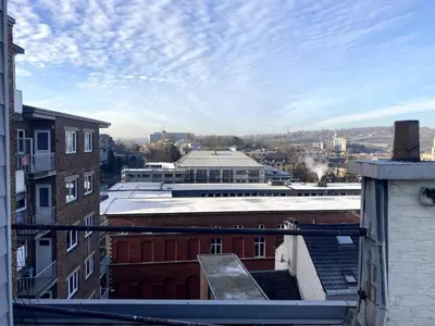a view of a city from the roof of a building at Bel appartement spacieux Verviers in Verviers