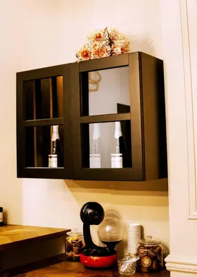 a cabinet with a mirror above a kitchen counter at Aslyra 