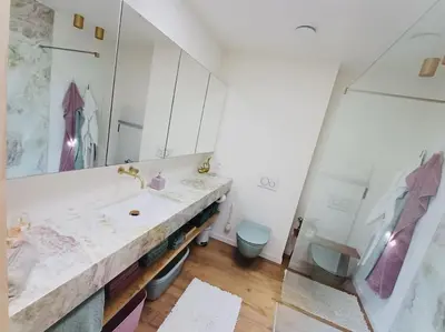 a bathroom with a sink and a toilet at Sweet Valley View - Architectenwoning in Zutendaal