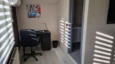 a room with a desk and a chair in a room at MARINA in Houthalen-Helchteren