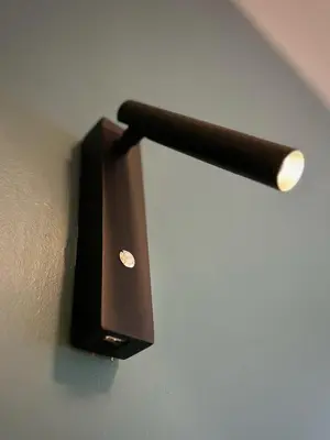 a black object is attached to a wall at Suite luxueuse aux Guillemins in Liège