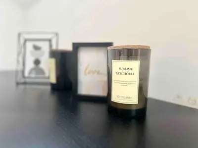 a candle sitting on top of a table at Le contemporain - Plein centre, place du Marché in Liège