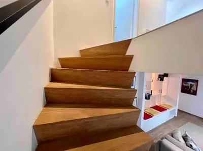 a staircase in a house with wooden steps at Le contemporain - Plein centre, place du Marché in Liège