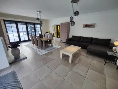 a living room with a couch and a table at Sluizen aan de Jeker in Tongeren