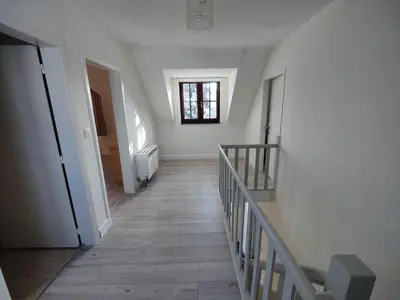 a hallway with stairs and a window in a building at Sluizen aan de Jeker in Tongeren