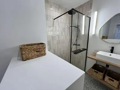 a white bathroom with a sink and a shower at Havre des Anges - Pont de Fragnée, Guillemins in Liège