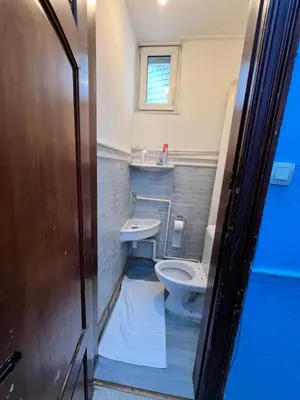 a bathroom with a toilet and a sink at Le Minimum in Liège