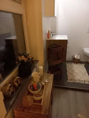 a bathroom with a table and a sink and a counter at Casa Barata in Riemst