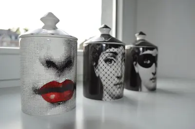 three canisters with faces on them sitting on a counter at B&B Opus35 in Montzen